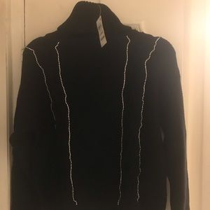 Black sweater with rhinestones in the front and solid in the back. Brand new